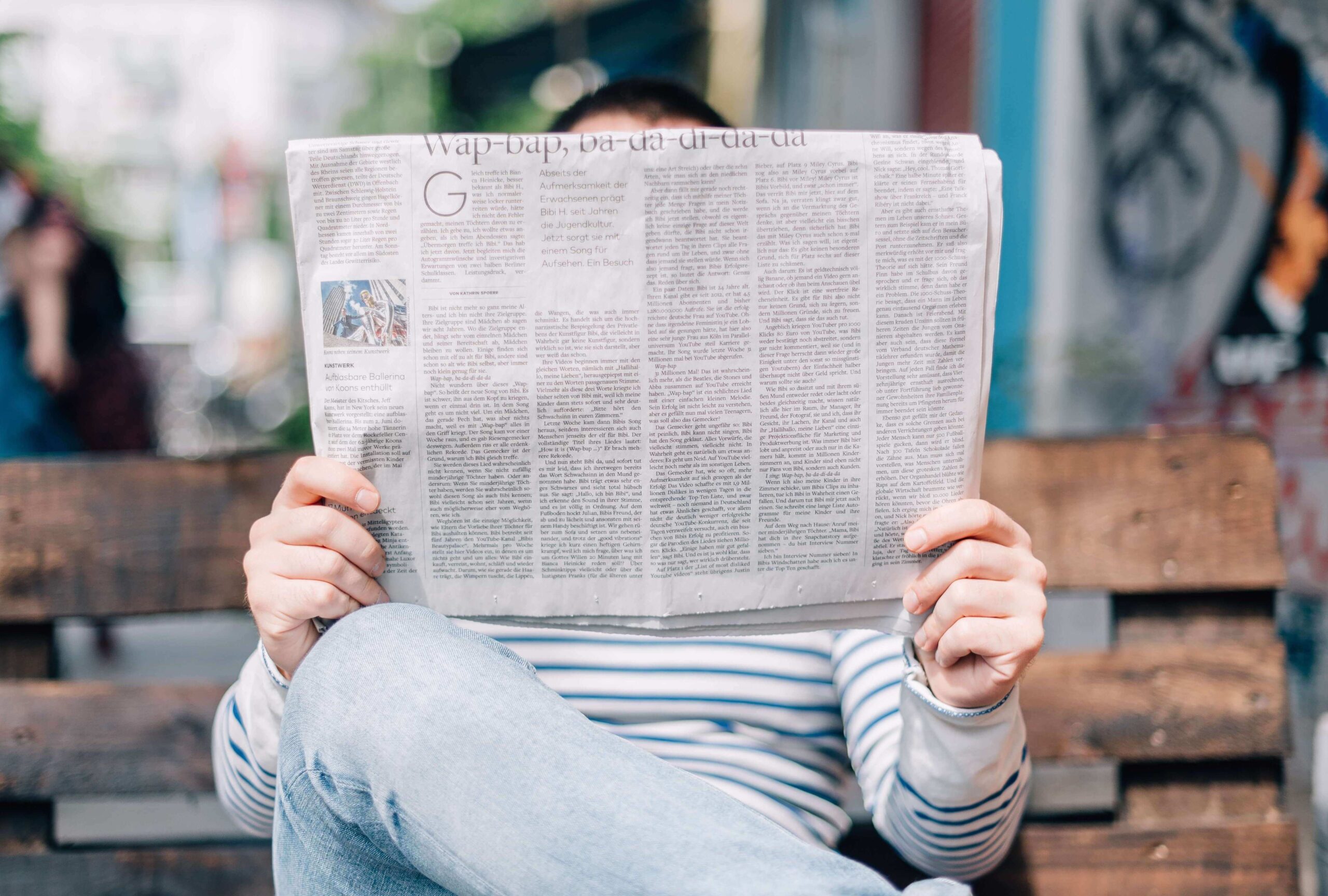 contact-us-section Man reading a paper